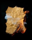 Burning piece of crumpled paper Royalty Free Stock Photo