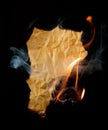 Burning piece of crumpled paper Royalty Free Stock Photo