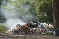 Burning pile of garbage, cause of air pollution