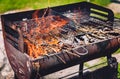 Burning and preheating old rusty barbecue grill cleaning dirty g