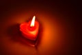 Burning red candle heart Royalty Free Stock Photo