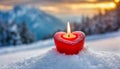 Burning red candle in shape of heart on the snow, blurred background. Winter love holiday. Valentine\'s Day Royalty Free Stock Photo