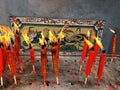 Burning red candles in a burner of a Chinese temple in Thailand Royalty Free Stock Photo