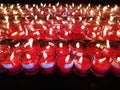 Burning red candles. Candles light background. Candle flame at night.