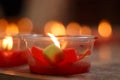 Burning red flower candle at chinese shrine for making merit in Royalty Free Stock Photo