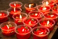 Burning red flower candle at chinese shrine for making merit in Royalty Free Stock Photo