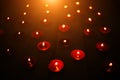 Burning red little candles in the dark Royalty Free Stock Photo