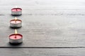Burning red tealight candles Royalty Free Stock Photo