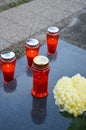 Red votive candles on the grave Royalty Free Stock Photo