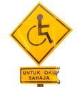 Burning of Reserved parking for Handicapped Only sign with Malaysian language `parking for handicapped only` beneath. Handicap sig