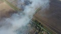 The burning of rice straw in the fields. Smoke from the burning of rice straw in checks. Fire on the field Royalty Free Stock Photo