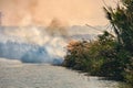 Burning of rice stubble burning straw in rice farmers Royalty Free Stock Photo