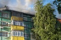 Burning roof of a residential high-rise building, clouds of smoke from the fire. top view Royalty Free Stock Photo