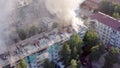 Burning roof of a residential high-rise building, clouds of smoke from the fire. top view Royalty Free Stock Photo