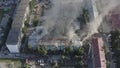 Burning roof of a residential high-rise building, clouds of smoke from the fire. top view Royalty Free Stock Photo