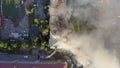 Burning roof of a residential high-rise building, clouds of smoke from the fire. top view Royalty Free Stock Photo