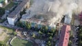 Burning roof of a residential high-rise building, clouds of smoke from the fire. top view Royalty Free Stock Photo