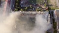 Burning roof of a residential high-rise building, clouds of smoke from the fire. top view Royalty Free Stock Photo