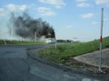 Burning RV on the Side of the Road Thick Black Smoke Royalty Free Stock Photo