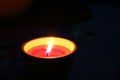 Burning single candle in dark. Blackout and power failure concept Royalty Free Stock Photo