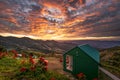 Burning Sky , mountain view with small house