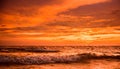 Burning Sky. The wave are nice while the sky full of burning color Royalty Free Stock Photo