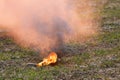 Burning smoke grenade lies on the battlefield