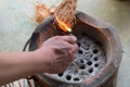 Burning and smoking coconut peel.