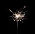 Burning sparkler on black background. Royalty Free Stock Photo