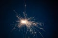 Burning sparkler fireworks on a dark blue background. Christmas and festive concept of the event. Fireshow Royalty Free Stock Photo