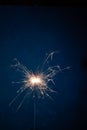 Burning sparkler fireworks on a dark blue background. Christmas and festive concept of the event. Fireshow Royalty Free Stock Photo