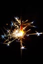 Burning sparkler isolated on black background blur detail