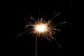 Burning sparkler isolated on black background. Fireworks theme. Light effect and texture Royalty Free Stock Photo