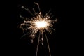 Burning sparkler isolated on black background. Fireworks theme. Light effect and texture Royalty Free Stock Photo
