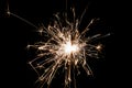 Burning sparkler isolated on black background. Fireworks theme. Light effect and texture Royalty Free Stock Photo