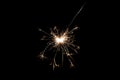 Burning sparkler isolated on black background. Fireworks theme. Light effect and texture Royalty Free Stock Photo