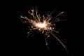 Burning sparkler isolated on black background. Fireworks theme. Light effect and texture Royalty Free Stock Photo