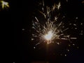 Burning sparkler producing spark around, celebration with fireworks and crackers during X mas and new year Royalty Free Stock Photo