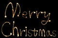 Burning sparkler stick and writing Merry Chistmas sparkling word Royalty Free Stock Photo