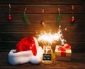 Burning sparklers in a New Year`s glass jar.