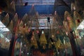 Burning spiral incense sticks hanging from the ceiling of a pagoda