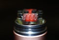 Burning staple staggered fused clapton coil in rebuildable dripping atomizer