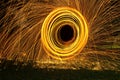 Burning steel wool spin in circles to make patterns