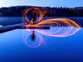 Burning steel wool spinning, showers of glowing sparks from spinning steel wool