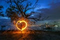 Burning steel wool under mangrove tree in heart shape