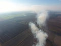 Burning straw in the fields after harvesting wheat Royalty Free Stock Photo