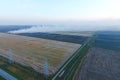 Burning straw in the fields after wheat crop Royalty Free Stock Photo