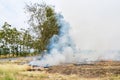 Burning straw in rice plantation in thailand Royalty Free Stock Photo