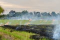 Burning straw stubble farmers when the harvest is complete. Royalty Free Stock Photo