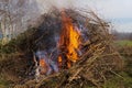 Burning stubble in the field with fire flame Royalty Free Stock Photo